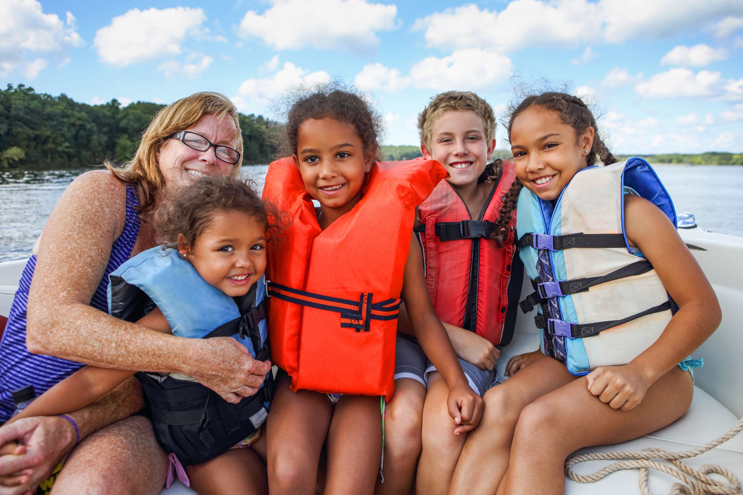 ExploreGear.com | Family boating safety with kids wearing life jackets