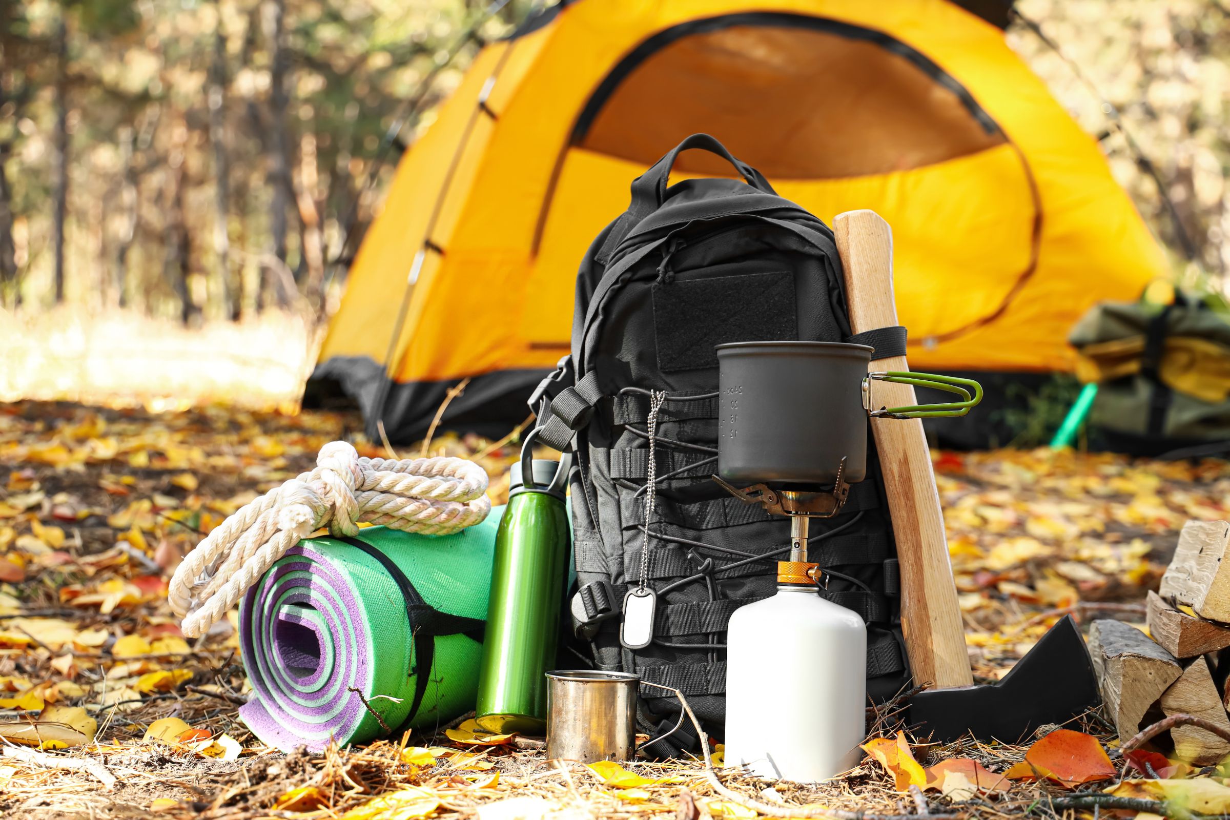 ExploreGear.com | Camping essentials including tent, rope, mat, backpack, and stove.